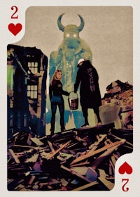 a pair of playing cards with a man and a woman standing in front of a pile of rubble